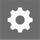 White settings cog symbol on a grey background