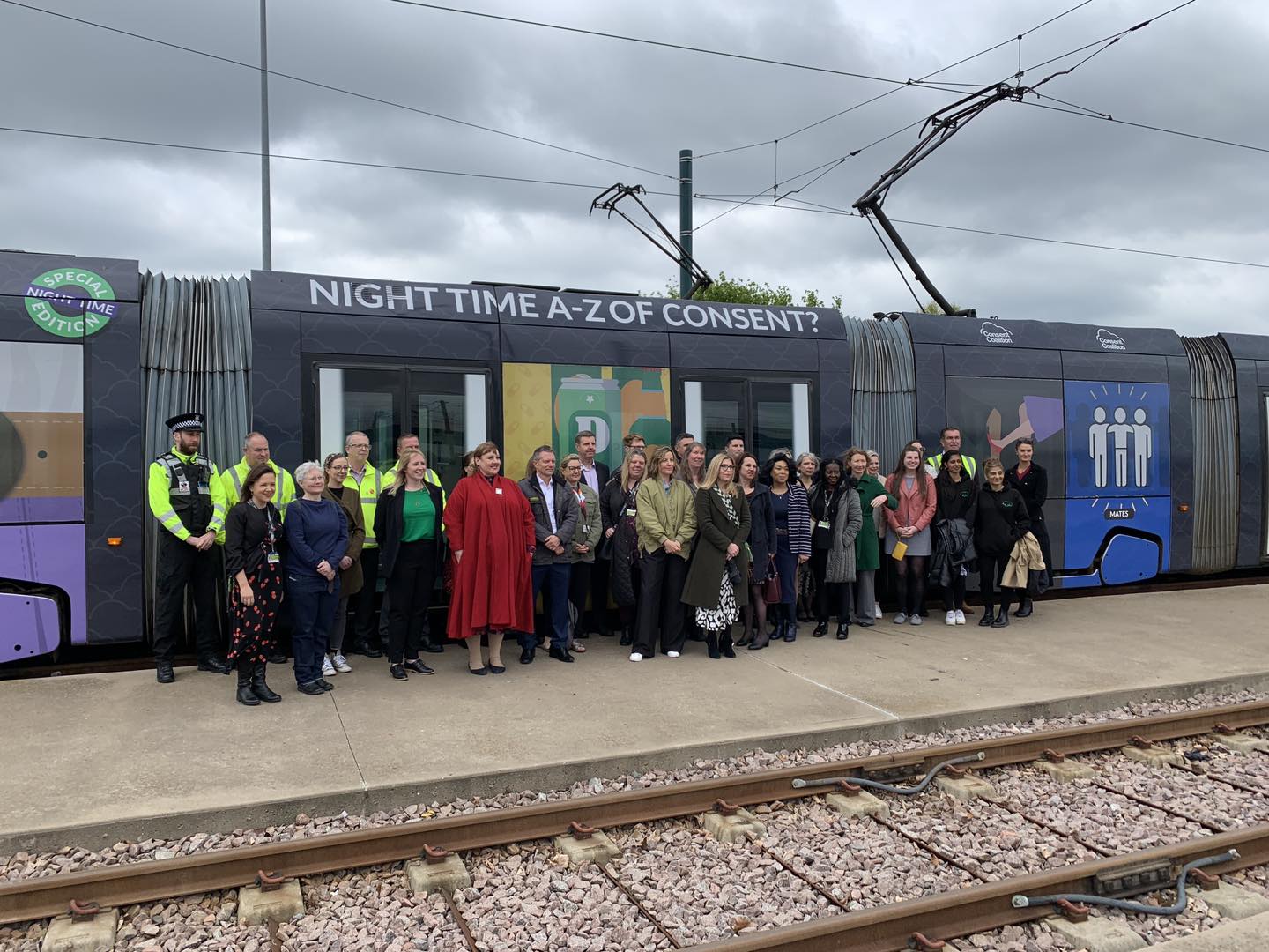 everyone-in-front-of-the-tram People gather in front of the new tram